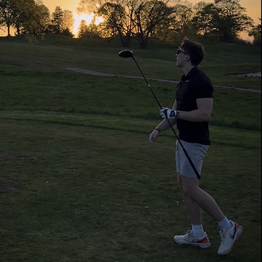 Steven Hainley on a golf course at sunset